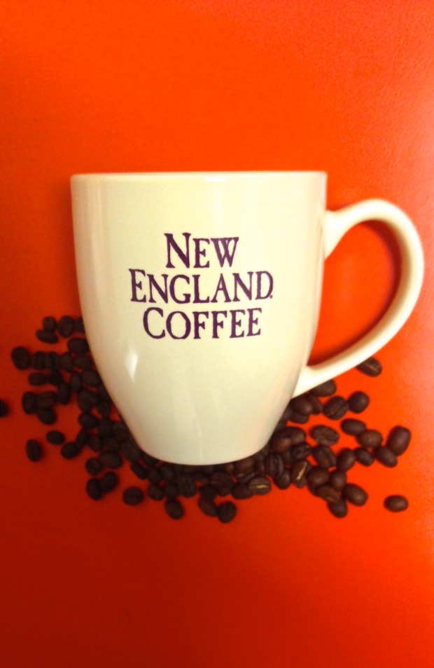 A white coffee mug on a red background